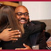 A scholarship recipient hugging her patron.