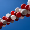 an image of a red and white balloon arch in the sky