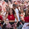 Fans cheer on the home team during the Homecoming football game.