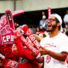 An image of the Temple University student section cheering at the Homecoming football game.
