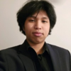 A headshot of Daniel Sayinal